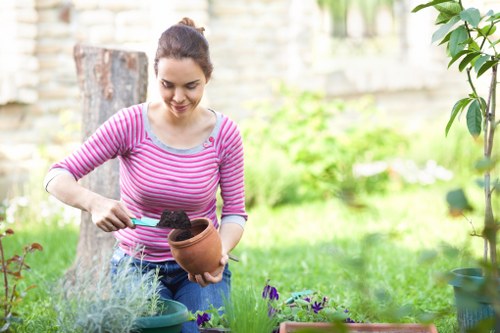 Compost bays and sorted recycling streams in a sustainable gardening area
